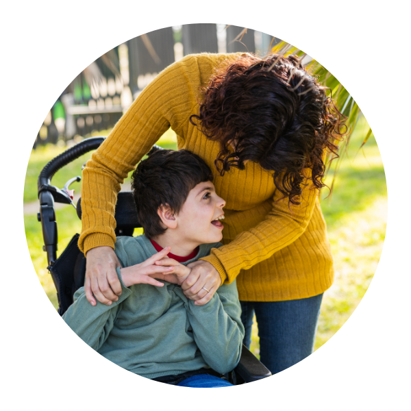 Mom and son connecting with genetic experts to uncover the root cause of unexplained symptoms.