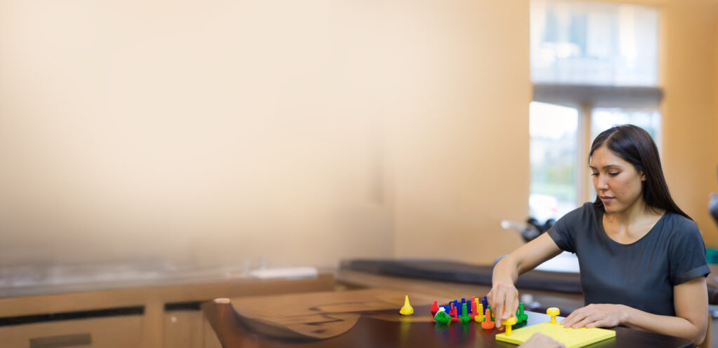 Woman works on her coordination and motor skills. 
