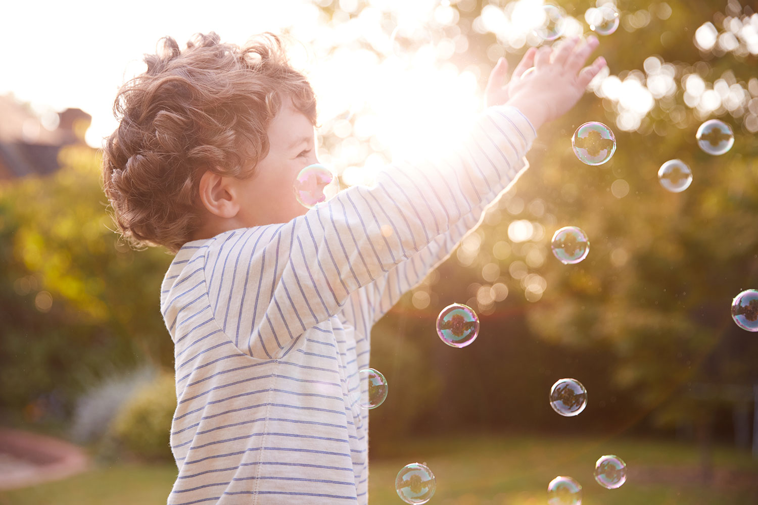 Child playing with bubbles