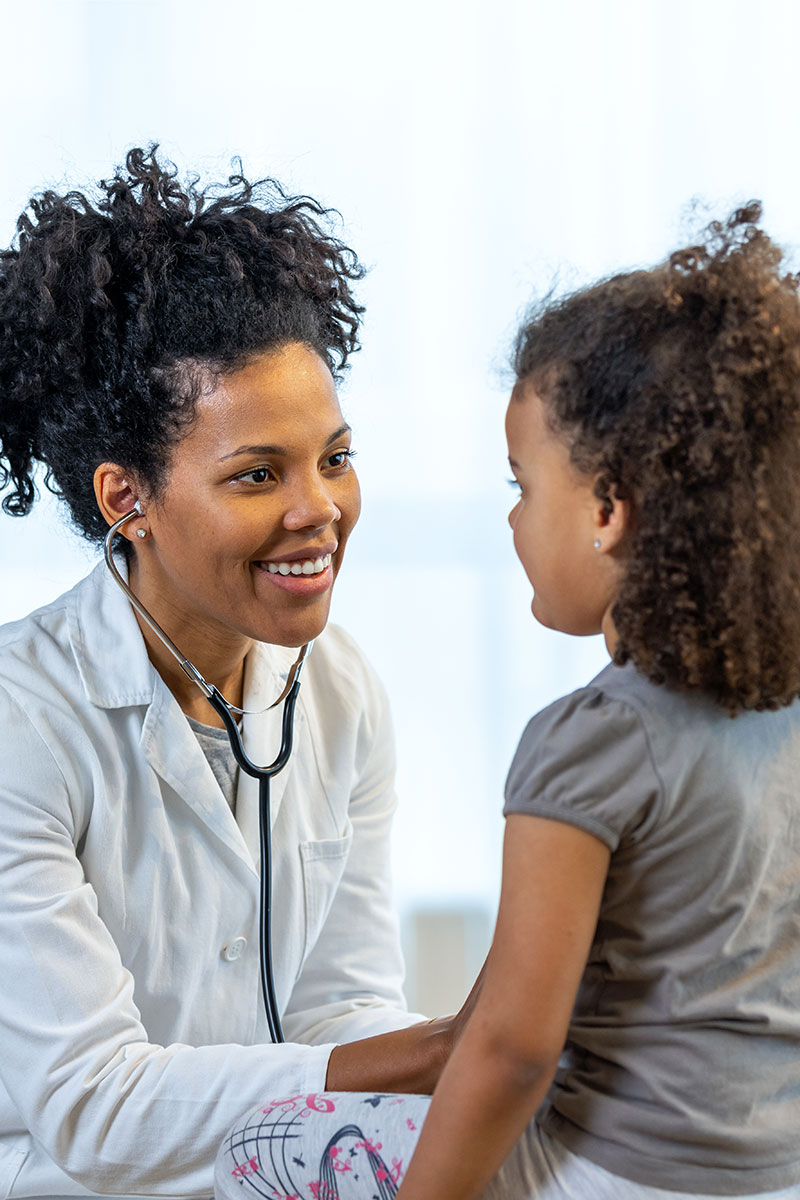 Pediatrician with patient